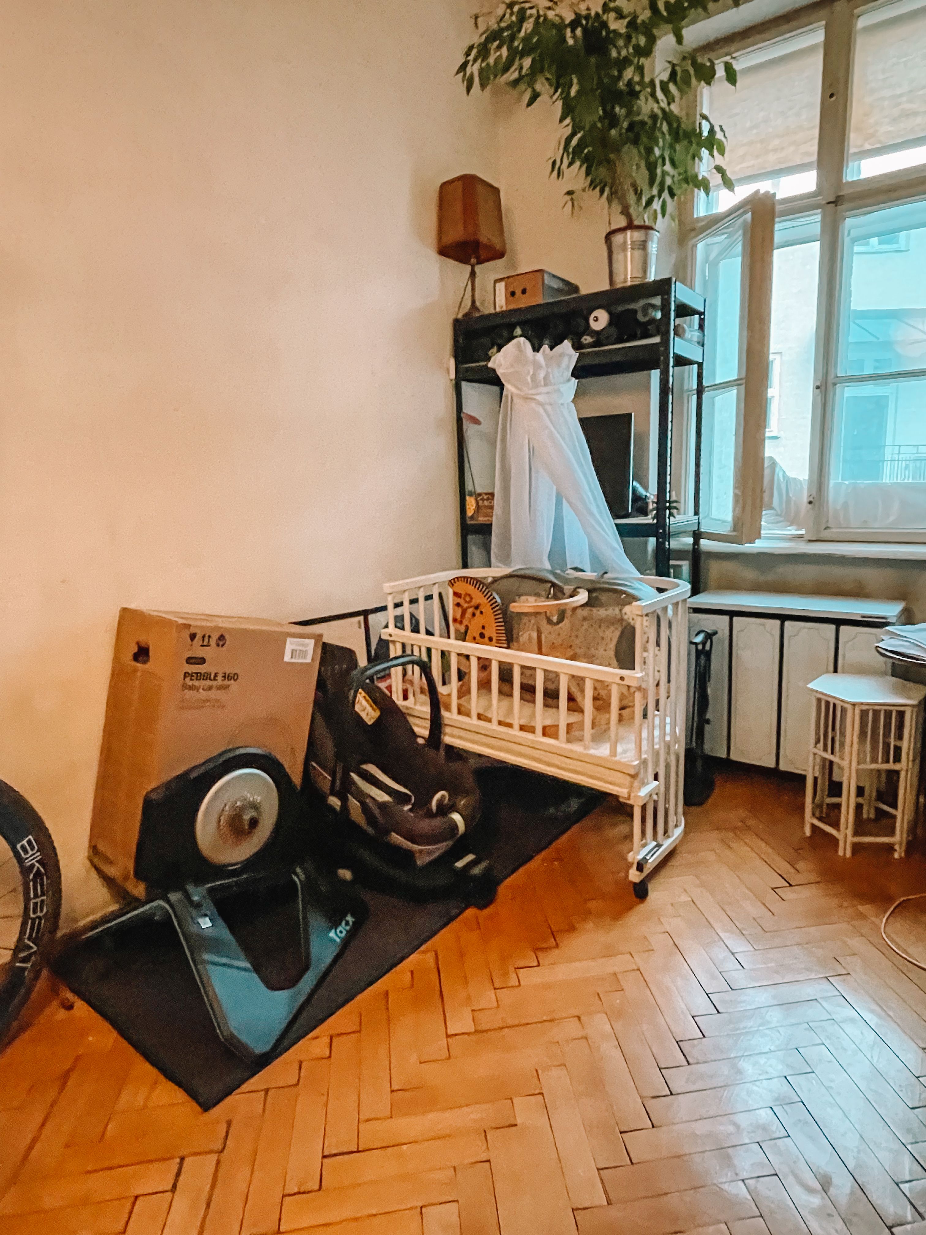 indoor cycling trainer and toddler's furniture. Welcome to the life of a mom to be!