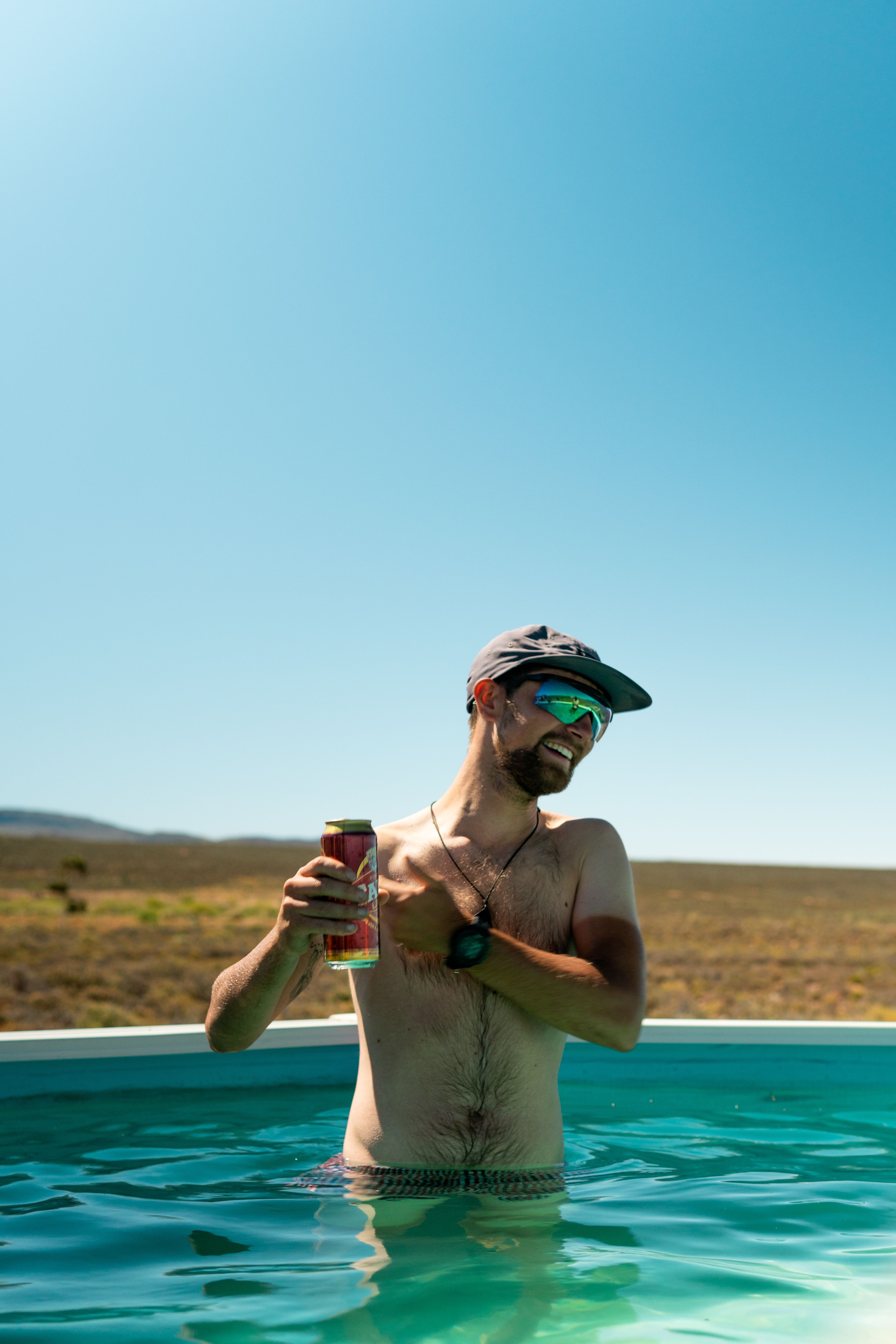 Max enjoys a cold one in the pool in the Tanqua