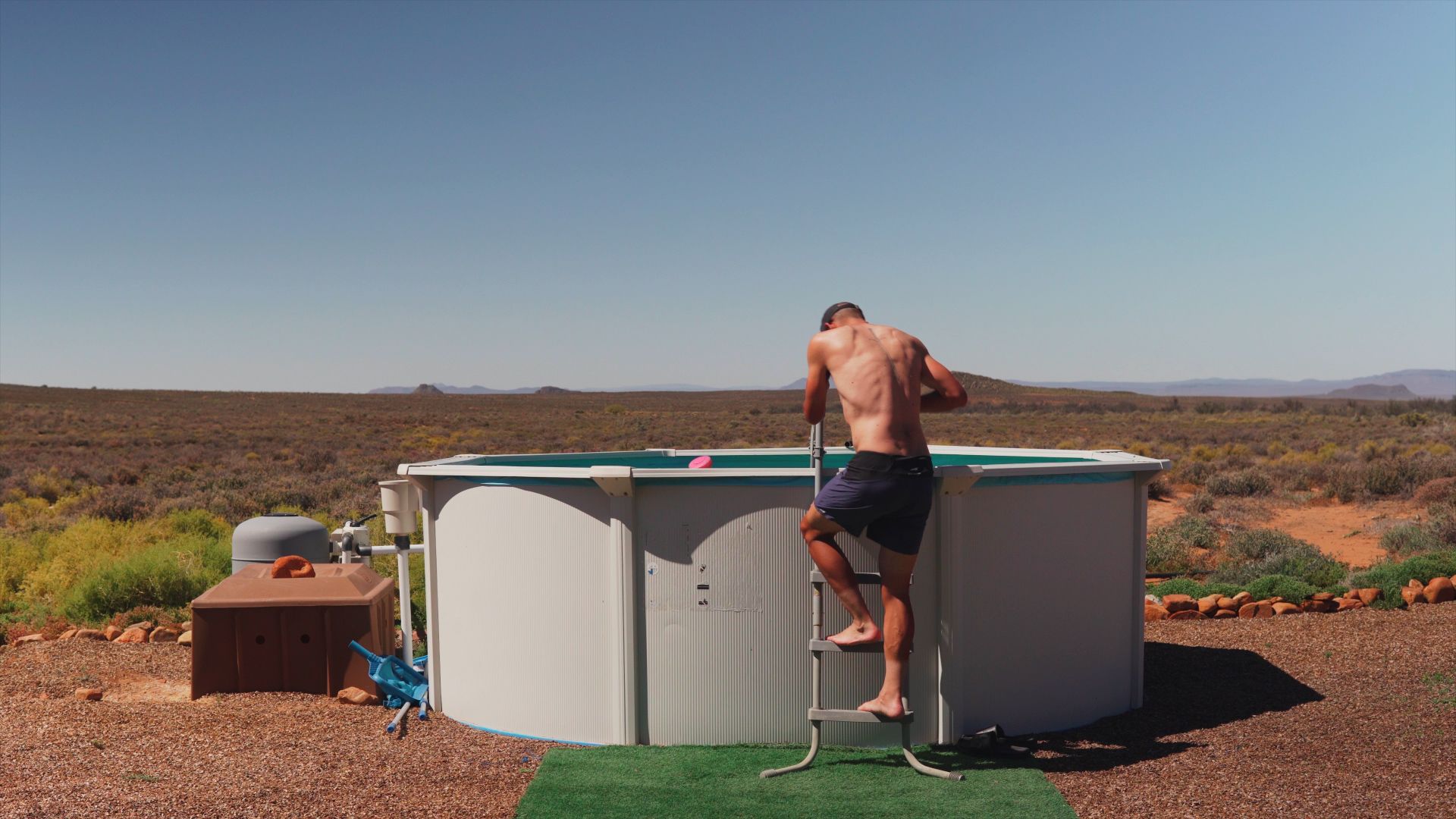 Rae getting into our pool in the middle of the desert