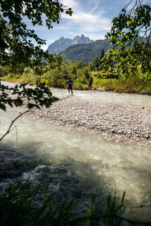 Cooling off during a gravelbike ride in an alpine river in Tirol, Austria