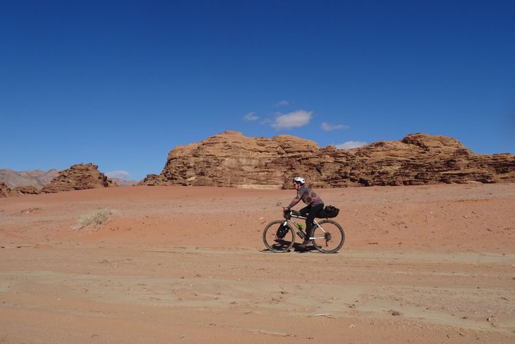 Bikepacking through the Wadi Rum desert in Jordan.