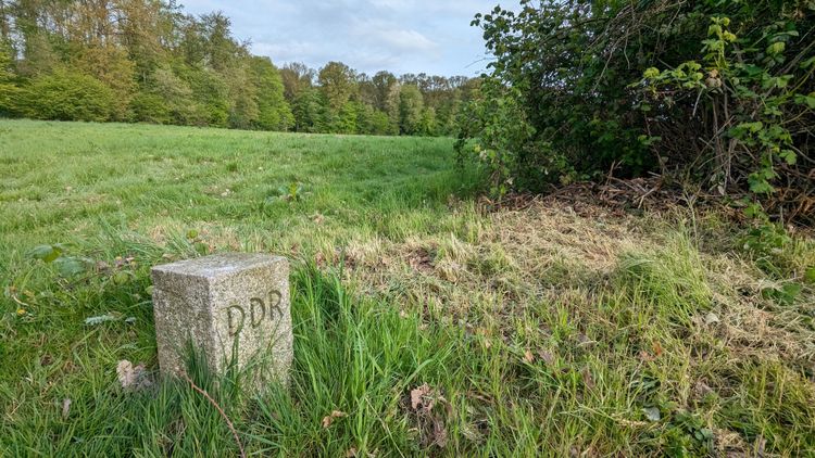 Historic boarder stone on the iron curtain trail signaling the former GDR.